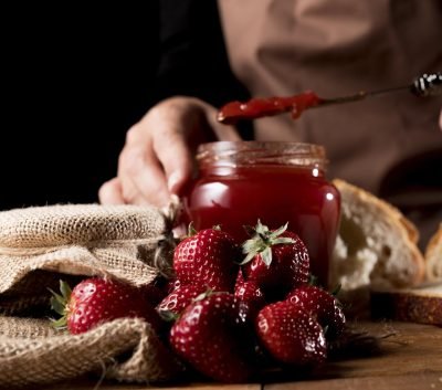 front-view-chef-with-jar-strawberry-jam